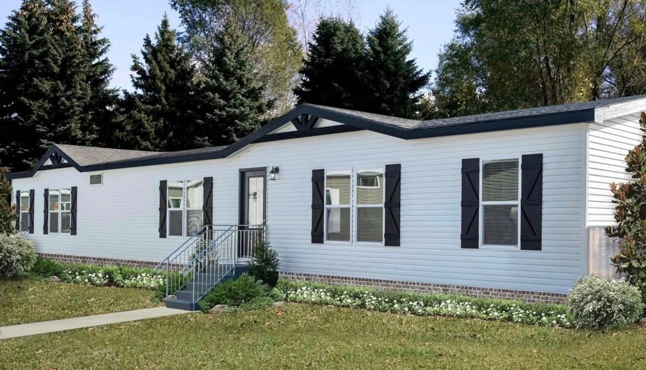 White manufactured home exterior with black shutters
